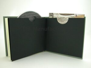 CD Book with swinging sleeve on left and glued on sleeve pocket sleeve on right