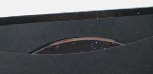 Close up disc sleeve pocket glued on black matte material, CD BOOK LITE