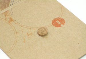 Close up of cork hub on fiberboard