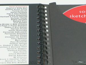 Spiral notebook with disc pocket