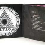 Inside cd book view showing foam hub and inner pages booklet front page 2 disc set