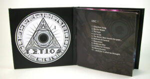 Inside cd book view showing foam hub and inner pages booklet front page 2 disc set