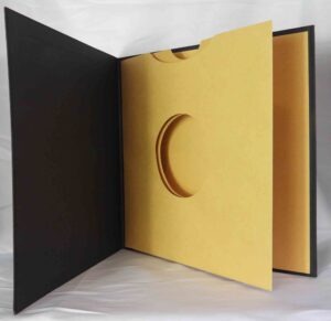 Vinyl LP Packaging with swinging sleeve die cut fiberboard exterior fabric paper linen wrap white foil VINYL BOOKS